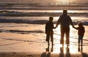W8 Advisory Newsletter Family on a beach